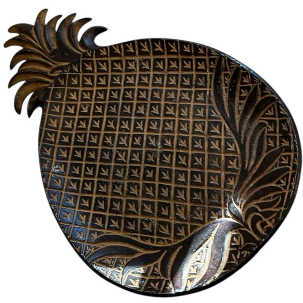 Pineapple platter is 16.5 in long and 9.5 in. at the widest point.Made in India